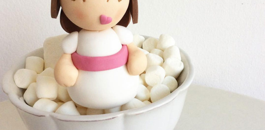 Comunión niña con lazo rosa